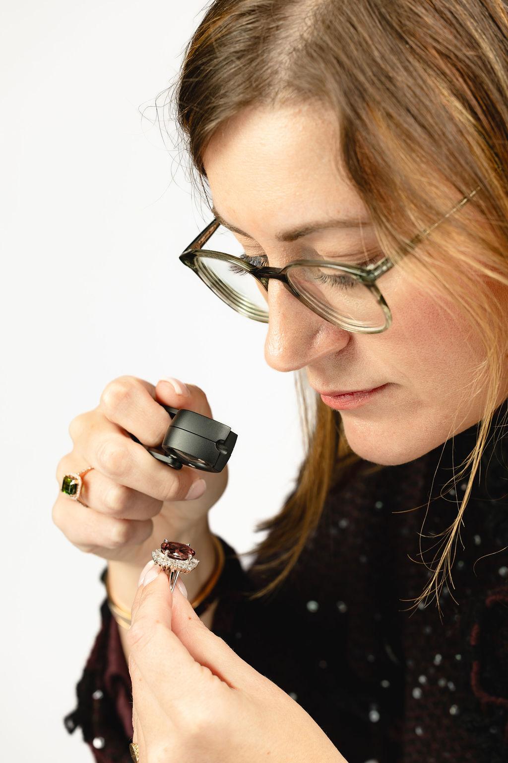 Stephanie Daugherty inspecting a ring