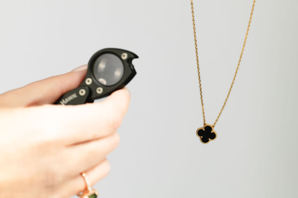Appraising jewelry with loupe