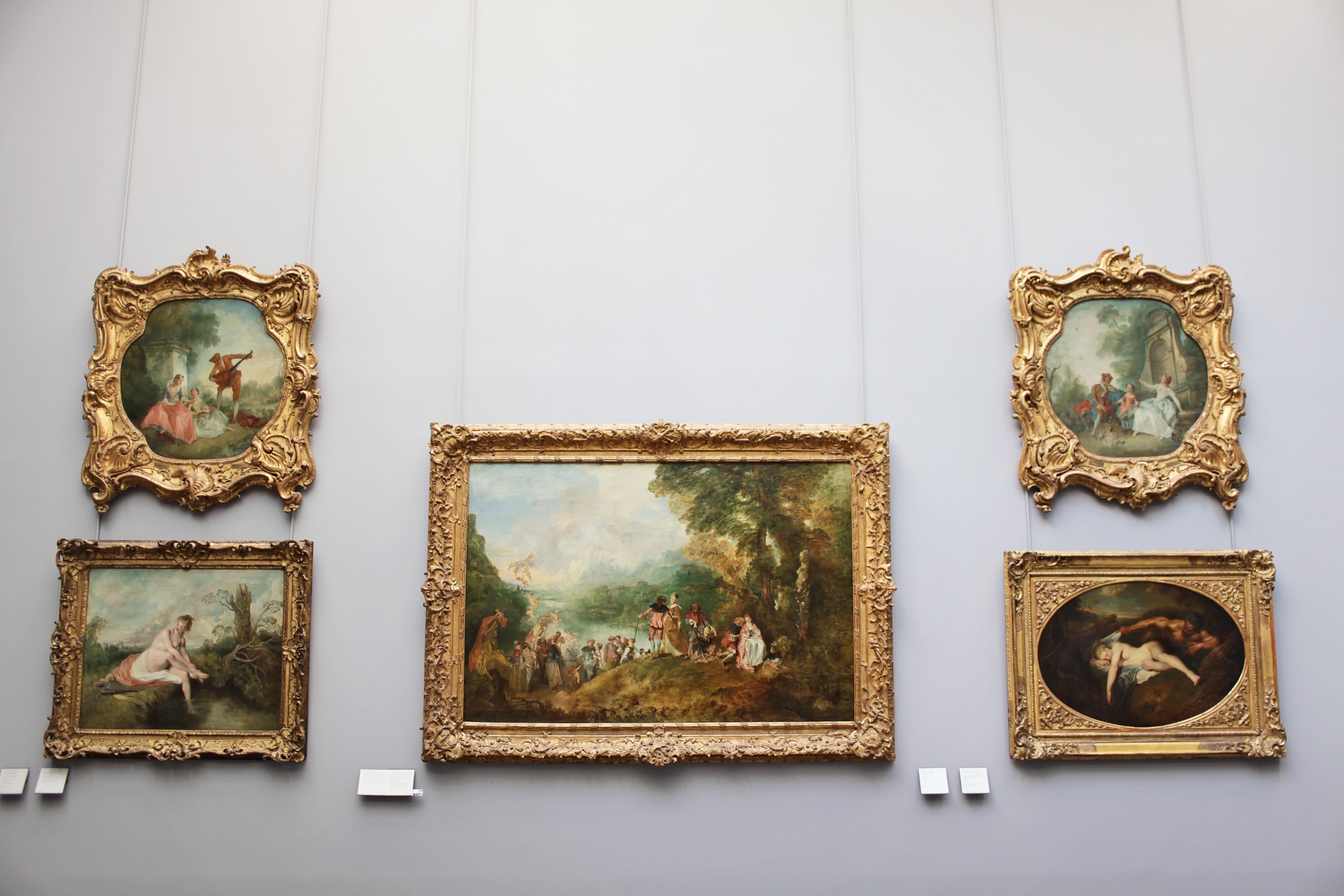 Gallery wall with ornate gold-framed baroque paintings