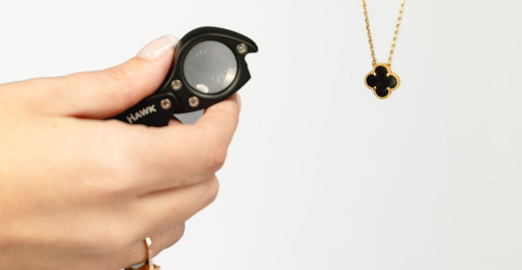 Examining jewelry with a loupe